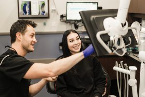 Dentist and Patient Discuss Cosmetic Dentistry Treatment
