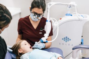 A child patient gets a dental laser cavity treatment at Oak Street Dental Victoria