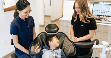 Anxiety free and friendly dentist interact with child patient