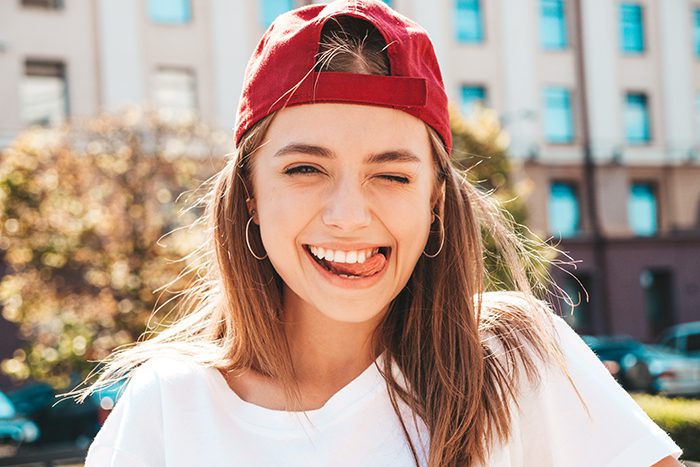 Young, active woman happy about dental treatment